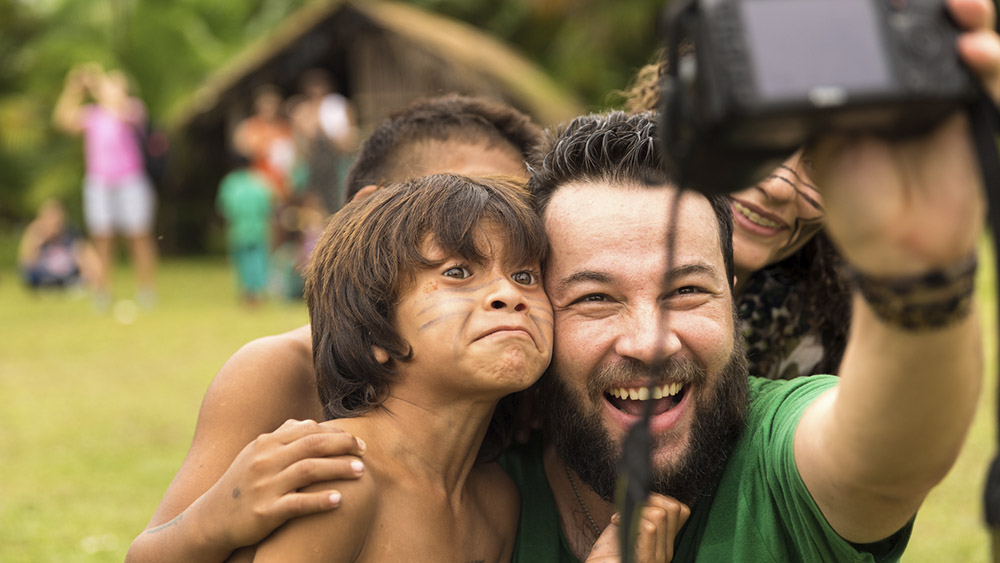 brazilian tourists taking selfie photos with brazilian natives (